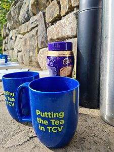 Two TCV mugs with flasks and hot chocolate