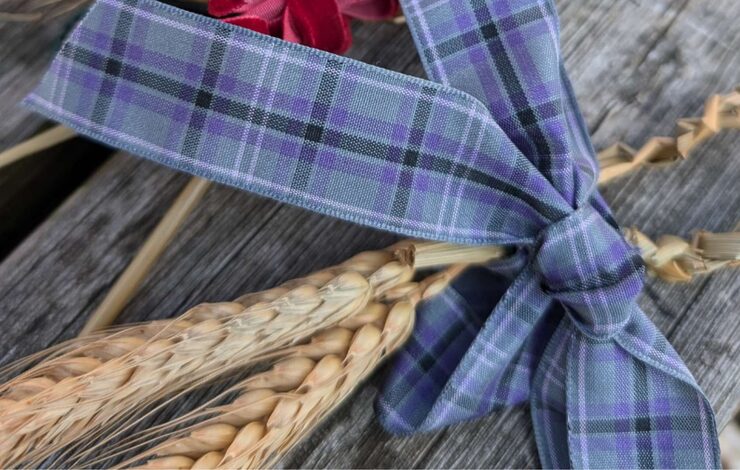 straw with tartan ribbon round it