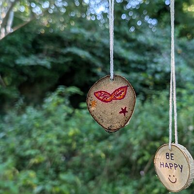 wishes written on wood and hanging on trees