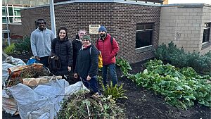 Volunteers from Diligenta helping clear gardens at the Western General Hospital