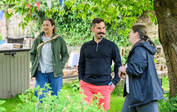 Three people outdoors attending a Branching Out event in Midlothian