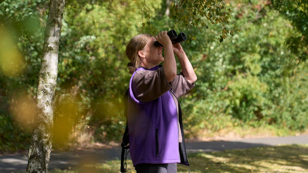 Nature Ranger Lou with binoculars at RIE
