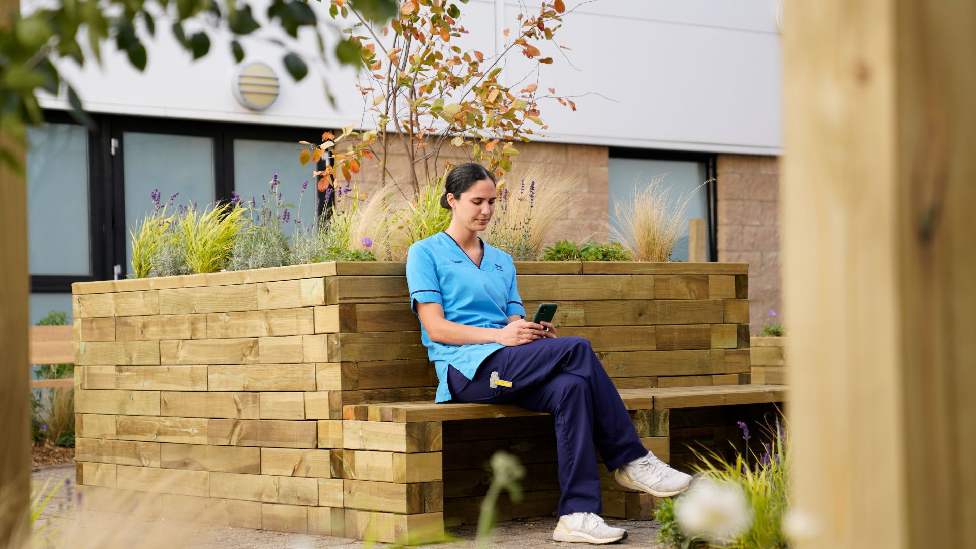 member of staff sitting in the staff wellbeing courtyard at the Royal Infirmary of Edinburgh