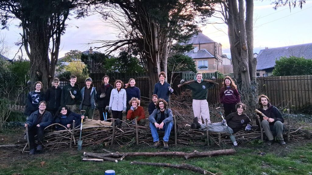 The University of Edinburgh's Dirty Weekenders conservation society smiling for the camera