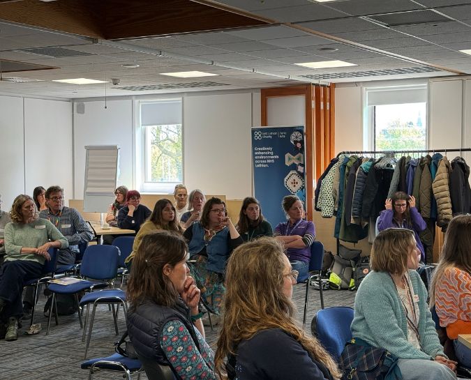 People in room listening to talk