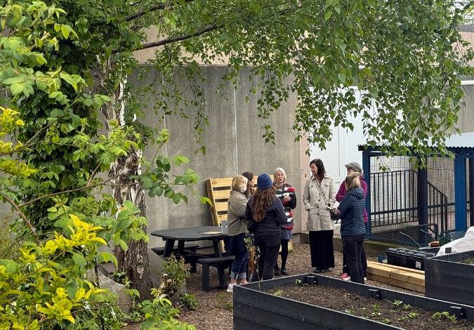 People chatting in a garden