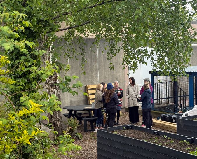 People chatting in a garden